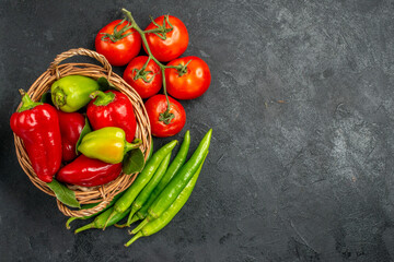 top view fresh bell-peppers with red tomatoes on dark background food salad ripe photo free place