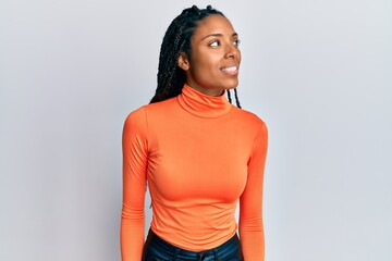 African american woman wearing casual clothes looking to side, relax profile pose with natural face...
