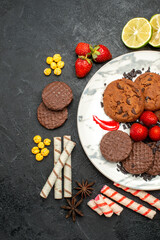 top view yummy choco biscuits for tea on dark background tea sweet cookie sugar