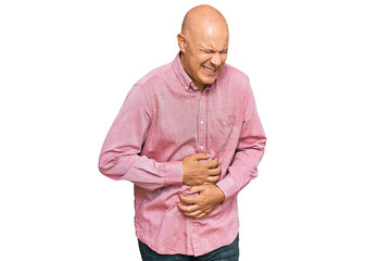 Middle age bald man wearing casual clothes with hand on stomach because nausea, painful disease...