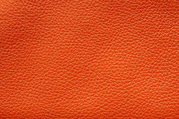 Fototapeta premium Orange colored cow leather texture. Closeup. Macro