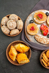 top view yummy pancakes with fruits and sweet cakes on the dark background dessert sweet cake