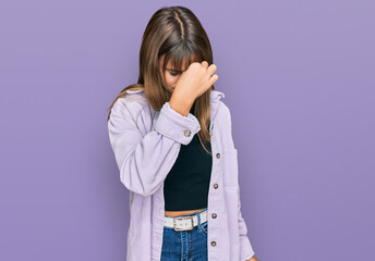 Teenager caucasian girl wearing casual clothes tired rubbing nose and eyes feeling fatigue and headache. stress and frustration concept.