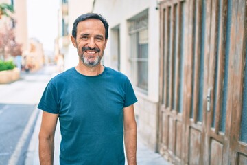 Middle age man with beard smiling happy outdoors