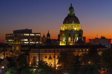 Fototapeta na wymiar Pasadena, California, USA - December 19, 2020: image showing the Pasadena City Hall and other buildings taken durin the civil twilight hour. A light pollution filter was use.