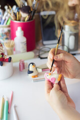 Cake decoration process. Baker uses the tools for sculpting fondant models. Edible art, cake...