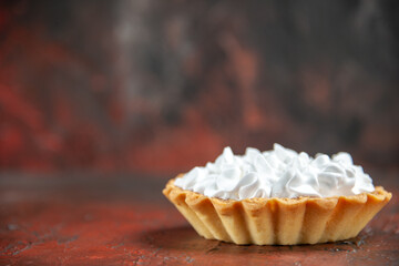 front view small tart with pastry cream on dark red background free place