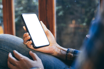 cell phone blank white screen mockup.woman hand holding texting using mobile on desk at office.background empty space for advertise.work people contact marketing business,technology