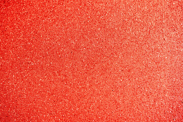 Fototapeta premium Abstract red background with glitter and bokeh closeup