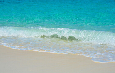 Beautiful beach with white powder sand and striking turquoise waters.