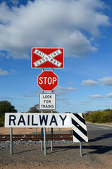 Signs on a railway crossing in rural Victoria, Australia