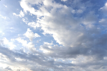 Landscape of the blue sky full with clouds in the summer with natural sunlight on the abstract wide space background, refer to the hope and freedom of the future