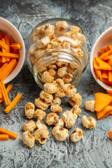 front view cheese cips with popcorn on light background rusk cips snack movie
