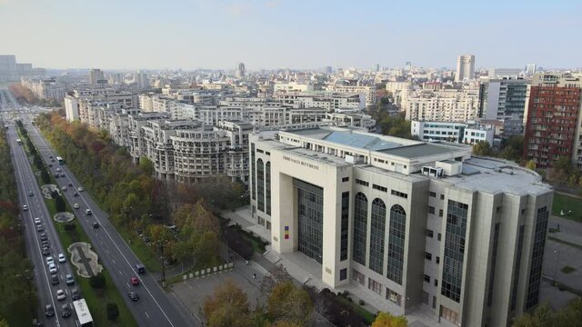 Aerial drone shot of Bucharest Court, Unirii Square Bucharest historical building communist for the Romanian Justice, central administration landmark tourism. Communism history sunset skyline