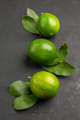 front view fresh sour lemons on dark background lime fruit citrus mellow ripe