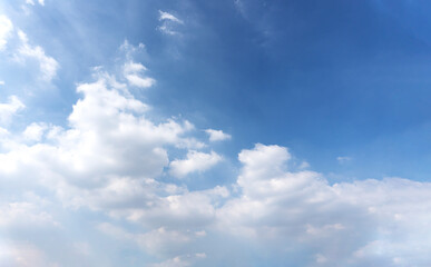 Landscape of the blue sky with clouds in the summer with natural sunlight over on the abstract wide space background, refer to the hope and freedom of the future