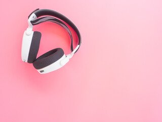 music headphones on pink background.