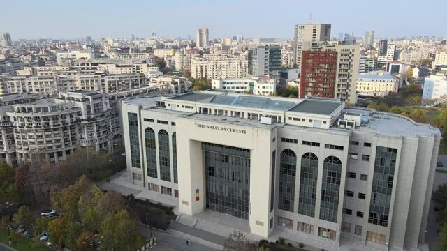 Aerial drone shot of Bucharest Court, Unirii Square in Bucharest historical building communist for the Romanian Justice, central administration landmark tourism. Communism history sunset skyline