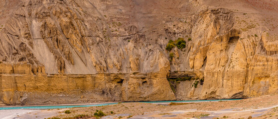 Gully erosion landscape prominent in cold desert of Spiti due to barren steep slopes and weak unconsolidated geological mud rocks. River erosion also visible on downward slopes of hills.