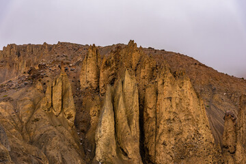 Pinnacles are geological landform of steep columns of rocks left by wind, water & ice weathering & erosion of soft rock leaving pillar of hard rock standing in horizontally bedded sedimentary rocks.