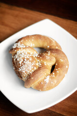vegan dairy-free organic german pretzel bread on wood table
