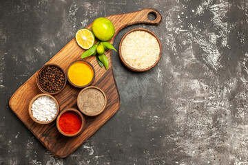 top view raw rice with seasonings and lemons on dark background raw food spice