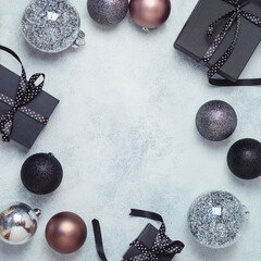 Christmas background with black gift boxes and decorations