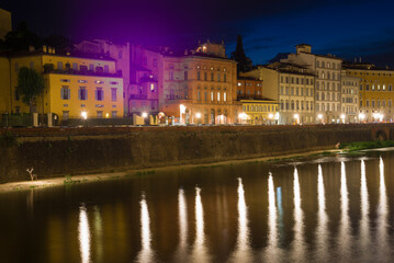 Fototapeta na wymiar Old city embankment in the night illumination. Florence, Italy