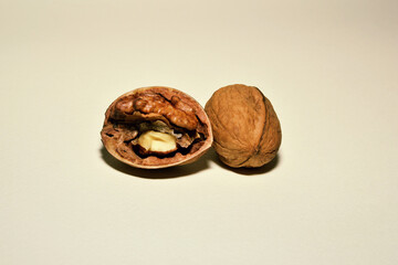 Open walnut rods next to a whole walnut close-up