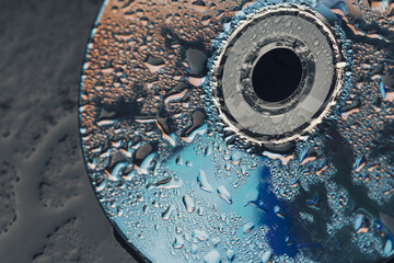 Macro shot of water drops on a CD . Close up