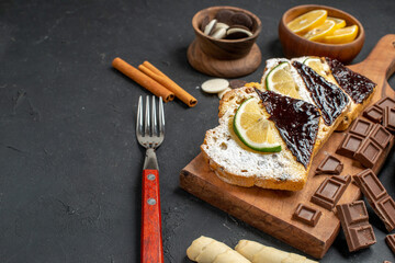 front view cake slices with cookies and chocolate on a dark background cake dessert pie sweet