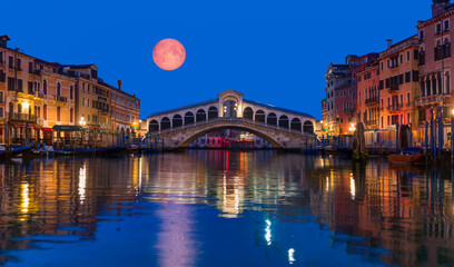 Gondola near Rialto Bridge with full moon - Venice, Italy 