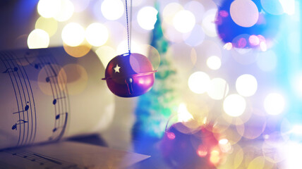 Christmas carol with jingle bells and candles