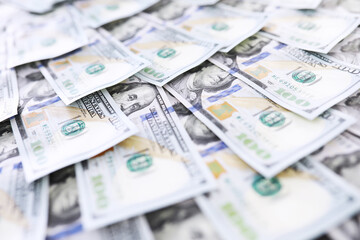 Group of money stack of 100 US dollars banknotes a lot of the background texture. Cash money in a large pile as a finance background.