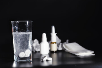 Composition from Bottles of cough syrup.Healthcare, medicine, flu and treatment concept - paper wipes and thermometer with pills.