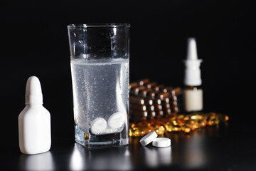 Composition from Bottles of cough syrup.Healthcare, medicine, flu and treatment concept - paper wipes and thermometer with pills.