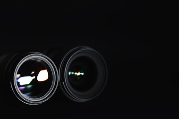 Optics to the camera on the operator’s desk. Flare in the glass of a photo lens. Background with...