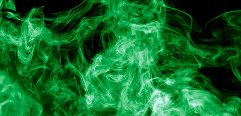 Green smoke isolated on black background. Abstraction