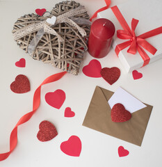 White Banner one envelope with many red heart, white gift box and candle. love Valentine day on 14th February. Send love latter, confession of love to beloved. craft envelope, copy space, layout, card