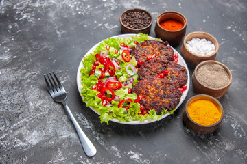 top view tasty meat cutlets with fresh salad on the grey background photo food dish meat