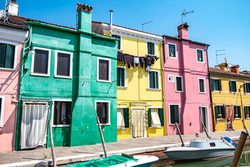 Venice landmark, Burano island canal, colorful houses and boats - 400506652