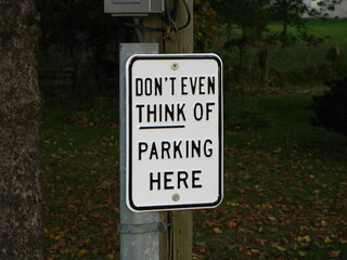A sign by the side of a road in St. Jacob's, Ontario, reads "Don't Even Think of Parking Here".