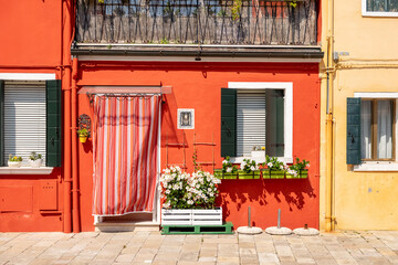 Venice landmark, Burano island canal, colorful houses and boats - 400506850