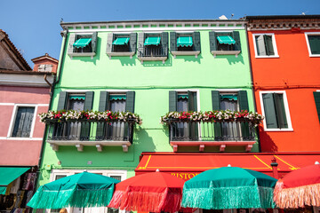 Venice landmark, Burano island canal, colorful houses and boats - 400506873