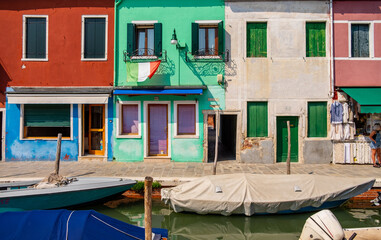 Venice landmark, Burano island canal, colorful houses and boats - 400507054