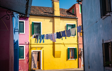 Venice landmark, Burano island canal, colorful houses and boats - 400507091