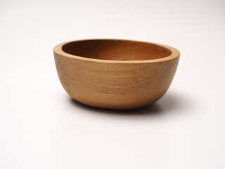Closeup picture of wooden bowl, shoot on a white isolated background