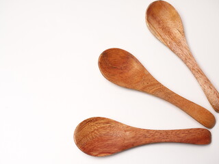 Close up shot of wooden spoon that made from mahogany wood, shoot on an isolated white background