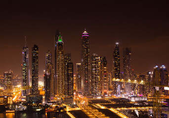 Dubai by night. The city and skyscrapers. The light in the night. The beauty of Dubai Marina just from the top.