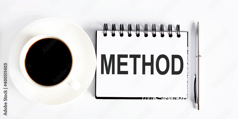 Poster method , planning concept. spiral notebook with text on white background with coffee
